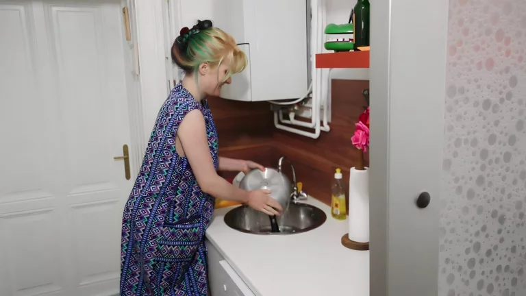 Horny MILF Rubbing Her Hairy Pussy In The Lirchen